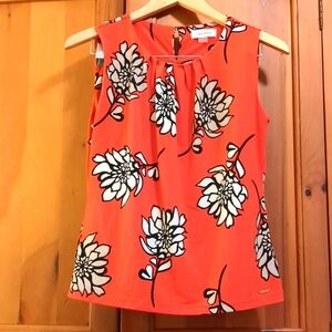 Calvin Klein floral blouse orange, black, and creme size small